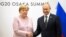 Путін та Меркель під час саміту G-20 в Осаці