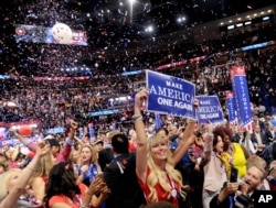 FILE -Delegates cheer then-presidential candedate Donald Trump on the fourth day of the Republican National Convention in Cleveland, Ohio, Aug. 7, 2016