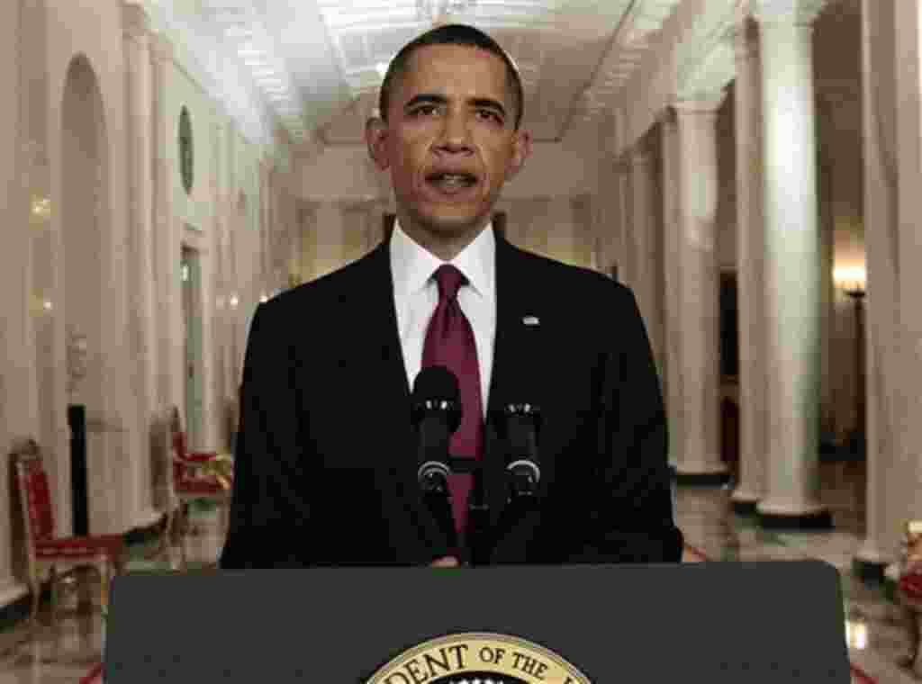 President Barack Obama reads his statement to photographers after making a televised statement on the death of Osama bin Laden from the East Room of the White House in Washington, Sunday, May 1, 2011. (AP Photo/Pablo Martinez Monsivais)