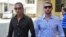 Italian sailors Salvatore Girone (R) and Massimiliano Latorre leave police commissioner office in the southern Indian city of Kochi Jan. 18, 2013.