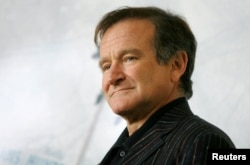 U.S. actor Robin Williams poses for photographers during a photo call