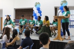 Student leaders and a professor at Duke University lead a presentation sharing information new international students will need.