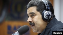 Venezuela's President Nicolas Maduro speaks during his radio program at Miraflores Palace in Caracas, Venezuela, Dec. 26, 2016.