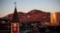 FILE - The sun sets over Nuuk, Greenland, July. 31, 2017. 