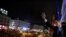Venezuelan opposition leader Juan Guaido gestures toward supporters from the balcony of the headquarters of Madrid's regional government in Madrid, Spain, Jan. 25, 2020.