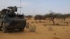 FILE - A light armored vehicle (LAV) of the French force of the counter-terrorism Barkhane mission in Africa's Sahel region Barkhane is parked at the roadside crossing of the town of Gossi, center Mali, March 25, 2019.