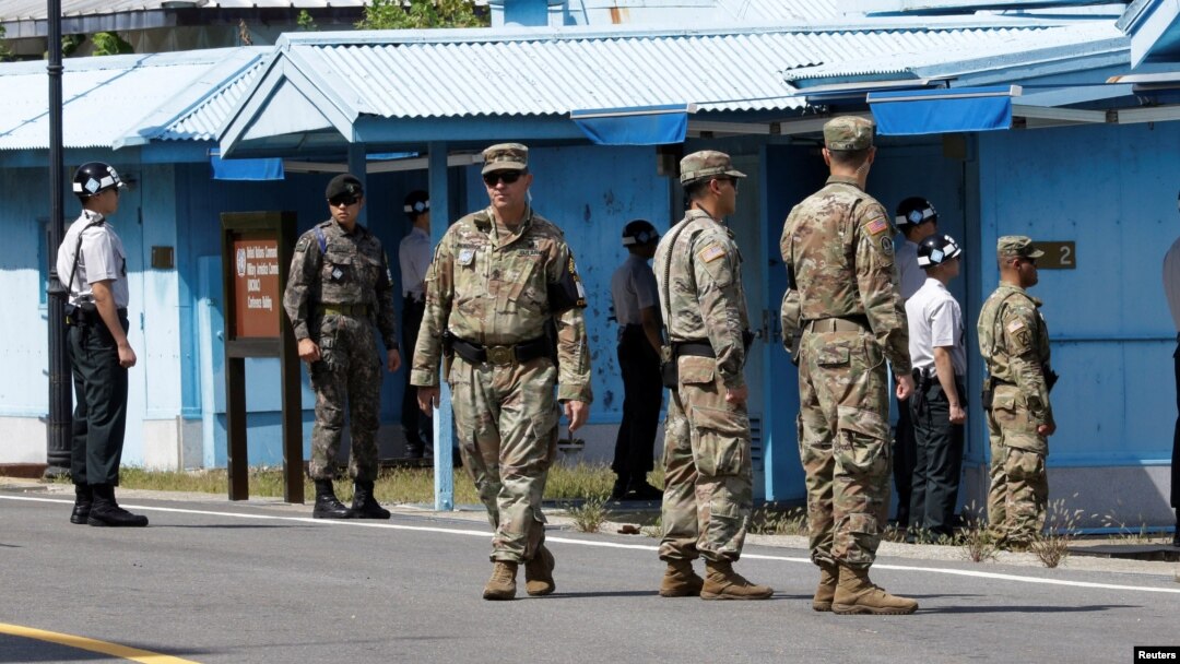 South Korean and U.S. Army soldiers stand guard at the border village of Panmunjom in the Demilitarized Zone, South Korea, Sept. 7, 2018. 
