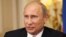 Russia's President Vladimir Putin speaks to the media during his visit to Britain's Prime Minister David Cameron at 10 Downing Street in London, Aug. 2, 2012.