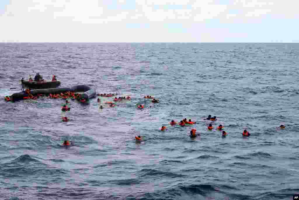 Refugees and migrants are rescued by members of the Spanish NGO Proactiva Open Arms, after leaving Libya and trying to reach European soil aboard an overcrowded rubber boat in the Mediterranean sea.