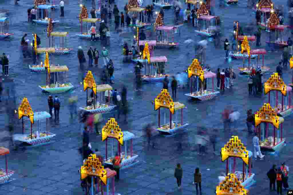 Representations of boats known as &quot;trajineras&quot; are on display in Mexico City&#39;s main square, the Zocalo, as part of the Day of the Dead festivities in Mexico City, Oct. 31, 2016.