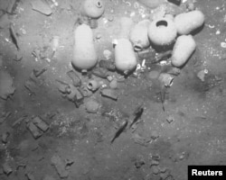 FILE - Artifacts found in the wreckage of Spanish galleon San Jose are seen in this undated handout photo provided by the Colombian Ministry of Culture, Dec. 5, 2015.