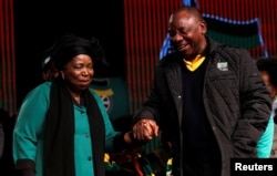 Former African Union chairperson Nkosazana Dlamini-Zuma chats with South Africa's deputy president Cyril Ramaphosa ahead of the African National Congress 5th National Policy Conference at the Nasrec Expo Centre in Soweto, June 30, 2017.