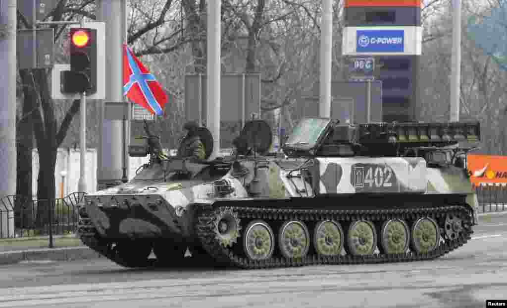 Pro-Russian rebels drive a Strela-10 self-propelled anti-aircraft system in Donetsk, Feb. 3, 2015.