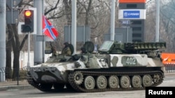 Pro-Russian rebels drive a Strela-10 self-propelled anti-aircraft system in Donetsk Feb. 3, 2015.