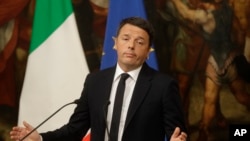 Italian Prime Minister Matteo Renzi speaks during a press conference at the premier's office Chigi Palace in Rome, early Monday, Dec. 5, 2016. Renzi acknowledged defeat in a constitutional referendum and announced he would resign on Monday. 