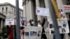 FILE - People and teachers protest against New York City mandated vaccines against the COVID-19 in front of the U.S. Courthouse in Manhattan, New York, Oct. 12, 2021.