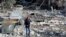 A resident checks the site of an Israeli airstrike in Tyre, southern Lebanon, Nov. 9, 2024. 