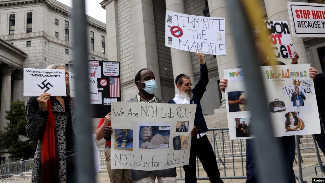 FILE - People protest against New York City-mandated vaccines against COVID-19, in front of the U.S. Courthouse in Manhattan, New York, Oct. 12, 2021.