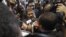 Mohamed Morsi, the Muslim Brotherhood's presidential candidate, is surrounded by reporters in Cairo, Egypt, May 26, 2012.
