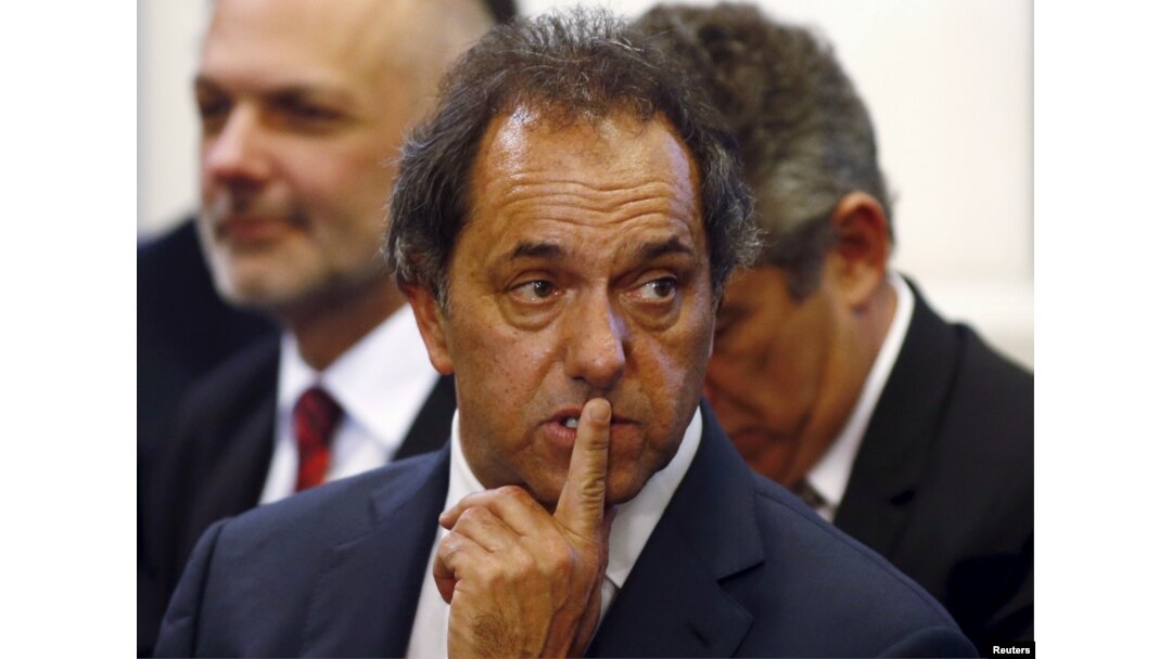 FILE - Daniel Scioli, governor of Buenos Aires province, gestures during a ceremony at the Casa Rosada Presidential Palace in Buenos Aires, September 30, 2014.