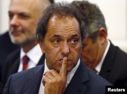 FILE - Daniel Scioli, governor of Buenos Aires province, gestures during a ceremony at the Casa Rosada Presidential Palace in Buenos Aires, September 30, 2014.