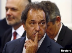 FILE - Daniel Scioli, governor of Buenos Aires province, gestures during a ceremony at the Casa Rosada Presidential Palace in Buenos Aires, Sept. 30, 2014.