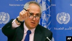 FILE - United Nations spokesman Stephane Dujarric fields questions at U.N. headquarters, June 20, 2017.