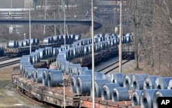 FILE - Steel coils sit on wagons when leaving the thyssenkrupp steel factory in Duisburg, Germany, March 2, 2018. President Donald Trump risks sparking a trade war with his steep tariffs on steel and aluminum imports, German officials and industry groups