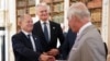 Britain's King Charles shakes hands with German Chancellor Olaf Scholz next to Lithuanian President Gitanas Nauseda during the European Political Community meeting, near Oxford, England, on July 18, 2024.