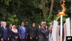 FILE— Rwandan President Paul Kagame lights a memorial flame during a ceremony to mark the 30th anniversary of the Rwandan genocide, held at the Kigali Genocide Memorial, in Kigali, Rwanda, Sunday, April 7, 2024.