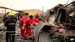Recovery workers look for bodies after a blaze ripped overnight through a COVID treatment ward at the Imam Hussein Teaching Hospital, in Nasiriyah, Iraq, July 13, 2021.