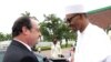 Nigerian President Muhammadu Buhari welcomes French President Francois Hollande in Abuja, site of a summit to discuss regional security and strategies to fight Boko Haram, May 14, 2016. 