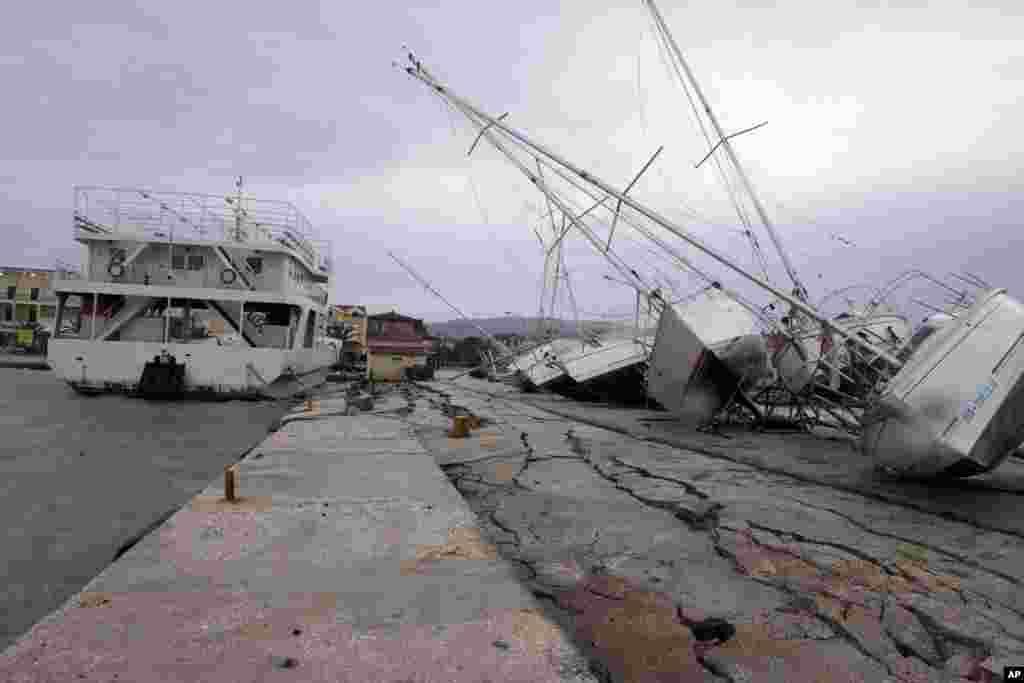 Damage after an earthquake at Lixouri port on the island of Kefalonia, western Greece. Quake with a preliminary magnitude between 5.7 and 6.1 hit the island of before dawn,, sending scared residents into the streets just over a week after a similar quake damaged hundreds of buildings. 