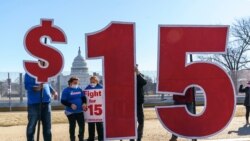 Activists appeal for a $15 minimum wage near the Capitol in Washington, Thursday, Feb. 25, 2021. The $1.9 trillion COVID-19 relief bill being prepped in Congress includes a provision that over five years would hike the federal minimum wage to $15 an…