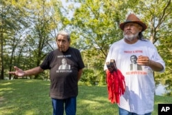 Ceremonial leader George Thompson, left, of Hickory Ground in the Muscogee Nation and Robyn Soweka Sr., of Hickory Ground Tribal Town, discuss their dispute with the Poarch Band of Alabama, Tuesday, Sept. 24, 2024, in Wetumoka, Ala. (AP/Vasha Hunt)