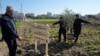 Palestinian farmers plant the first olive tree, part of the joint Freedom Farm project of the Palestinian Farmers Union and the Treedom for Palestine 2025 in memory of President Jimmy Carter, in the West Bank city of Tulkarem, Jan. 13, 2025.