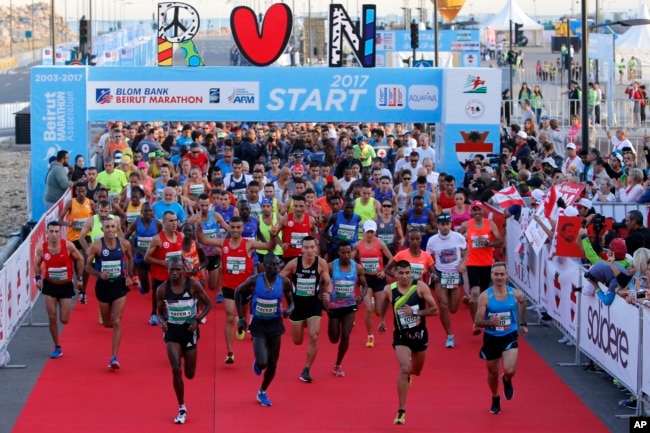 Runners compete in the Beirut Marathon, Sunday, Nov. 12, 2017. Absent from the marathon this year is the outgoing PM Saad Hariri, a regular participant, who resigned from his post unexpectedly last week while in Saudi Arabia.