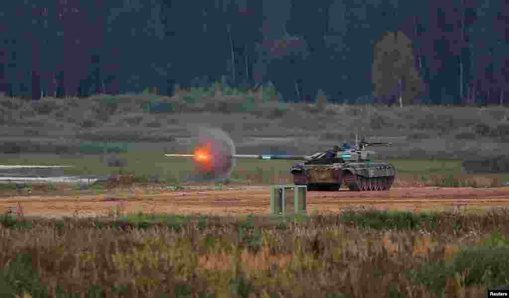 A T-72 B3 tank operated by a crew from Uzbekistan fires during the Tank Biathlon competition at the International Army Games 2020 in Alabino, outside Moscow, Russia, Sept. 2, 2020.