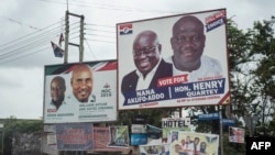FILE - The campaign billboards of Ghana's two main political parties running in this year's national election are shown in the streets of Accra in Ghana, Oct. 8, 2016.