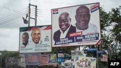 The campaign billboards of Ghana's two main political parties competing in this year's national elections are seen in the streets of Accra in Ghana, Oct. 8, 2016.