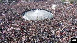 Syrian President Bashar al-Assad's supporters gather to demonstrate their support for their president, in Damascus, March 29, 2011