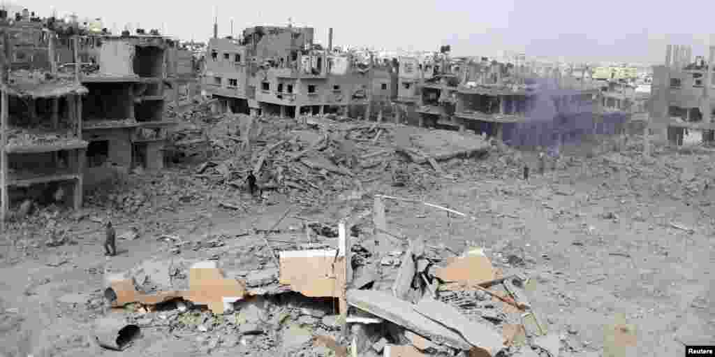 Destroyed and damaged houses in Beit Hanoun, which witnesses said was heavily hit by Israeli shelling and air strikes during an offensive in the northern Gaza Strip, July 26, 2014.