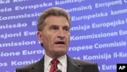 European Commissioner for Energy Guenther Oettinger addresses the media at the European Commission headquarters in Brussels, May 25, 2011
