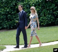 FILE - Ivanka Trump, daughter and assistant to President Donald Trump, and her husband, White House senior adviser Jared Kushner, walk out to join President Trump aboard the Marine One helicopter, May 19, 2017.