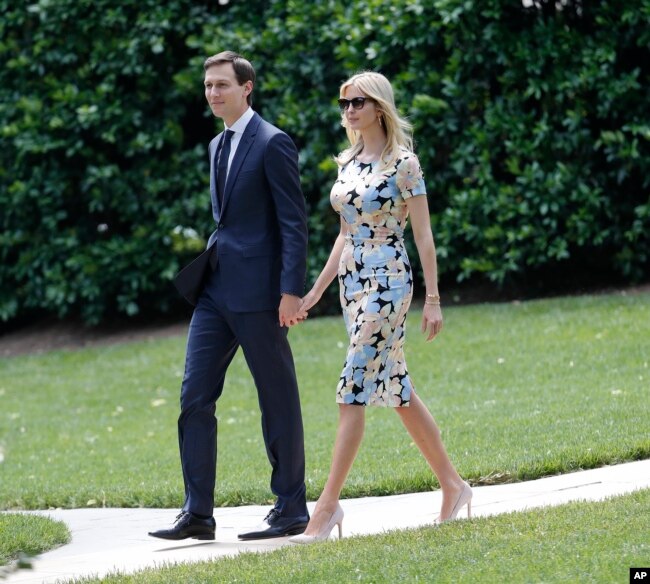 FILE - Ivanka Trump, daughter and assistant to President Donald Trump, and her husband White House senior adviser Jared Kushner, walk out to join President Trump aboard Marine One helicopter, May 19, 2017.