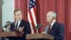 FILE - President George H.W. Bush gestures during a joint news conference with Soviet President Mikhail Gorbachev, at the Soviet Embassy in Madrid, Oct. 29, 1991. Bush died at the age of 94 on Friday, Nov. 30, 2018.