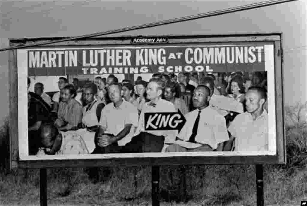 This sign, one of several billboards on route 80, March 23, 1965, purports to show Dr. Martin Luther King, Jr., at a Communist training school. (AP Photo/stf)