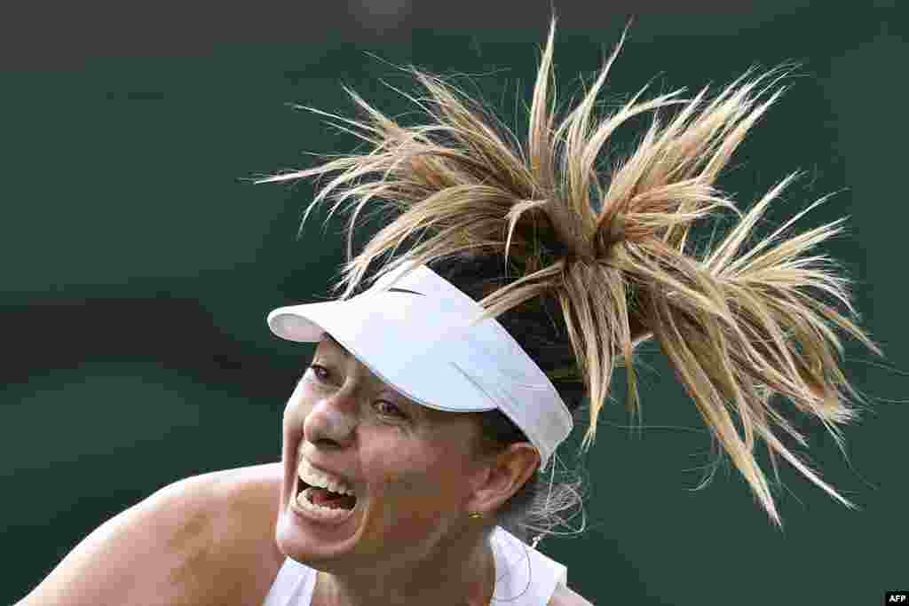 Russia&#39;s Maria Sharapova serves against France&#39;s Pauline Parmentier during their women&#39;s singles first round match on the second day of the 2019 Wimbledon Championships at The All England Lawn Tennis Club in Wimbledon, southwest London.