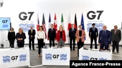 G-7 Foreign and Development Ministers pose for a family photograph during the final day of the G-7 summit in Liverpool, north-west England, Dec. 12, 2021.