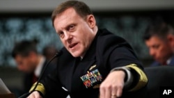 FILE - U.S. Cyber Command and National Security Agency Director Admiral Mike Rogers testifies on Capitol Hill in Washington before the Senate Armed Services Committee, May 9, 2017.